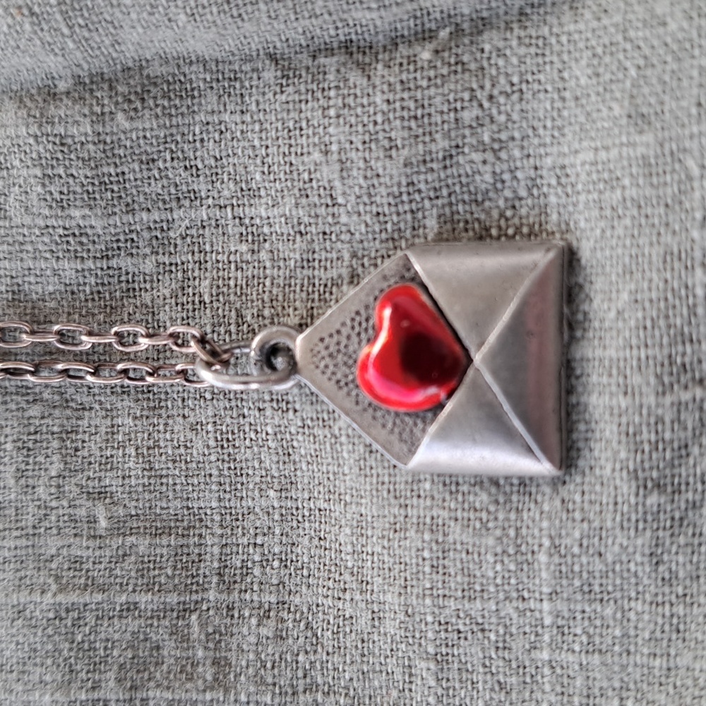 Valentine necklace.Silver in color. Previously owned.